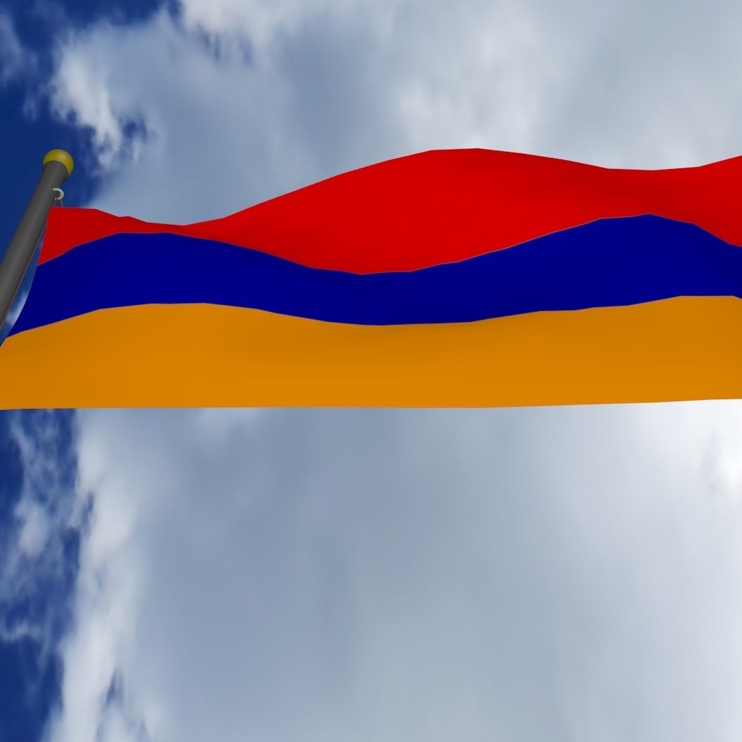 The Armenian flag flying against a cloudy sky