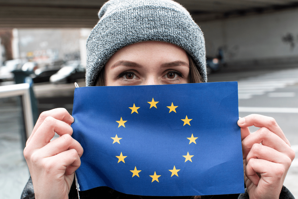 A woman holding the EU flag
