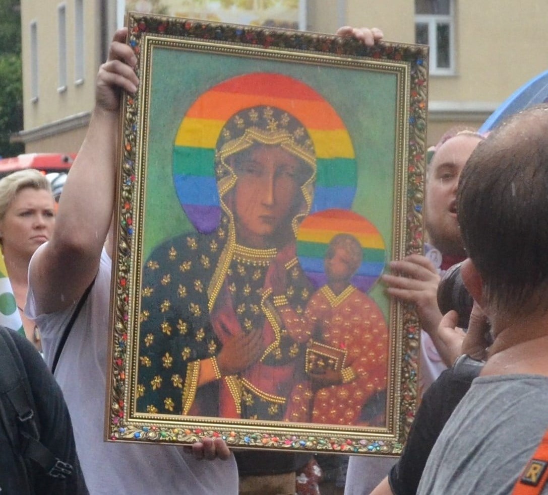 A portrait of the Virgin Mary with a rainbow halo