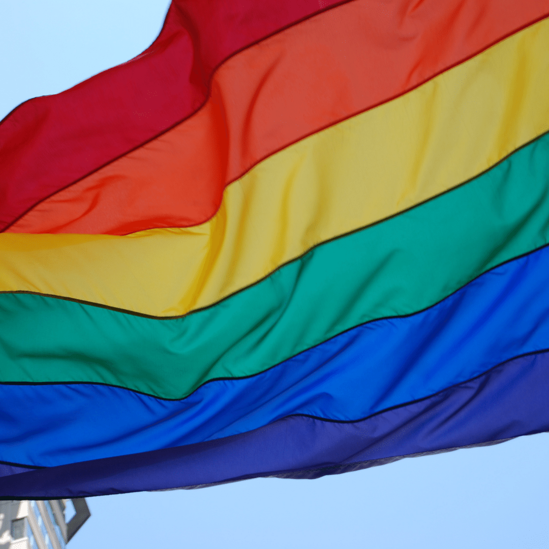An LGBTI flag blowing in the wind