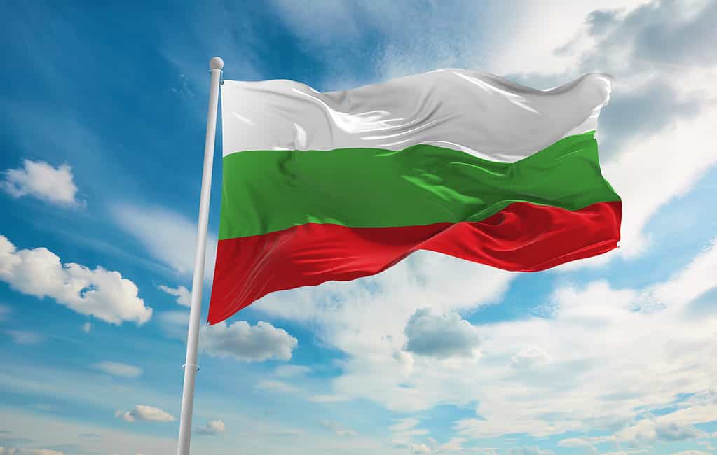A Bulgarian flag flies against a blue sky
