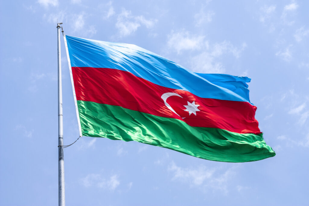 "The national flag of Azerbaijan is being raised into the sky."