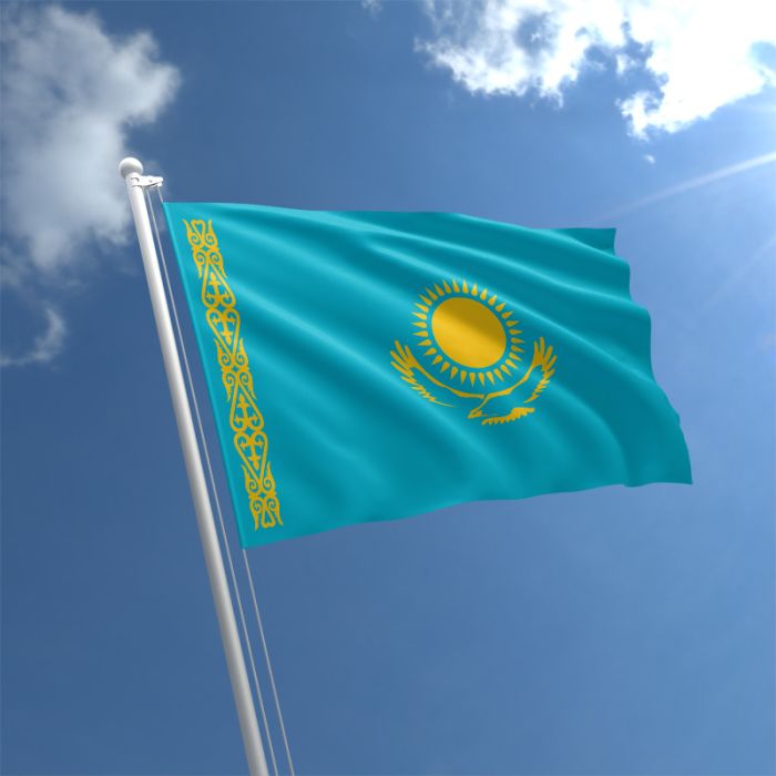 A flag of Kazahstan, raised in the sky